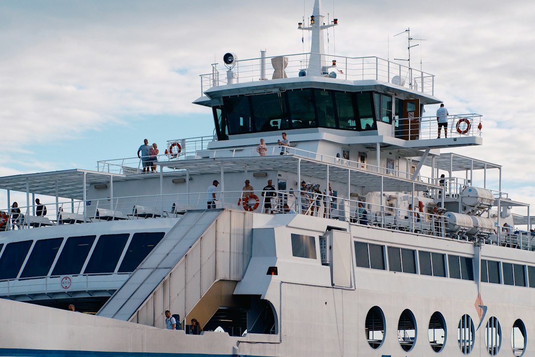 a-white-ferry-boat-is-sailing-on-the-water-nclaaz-jk7q